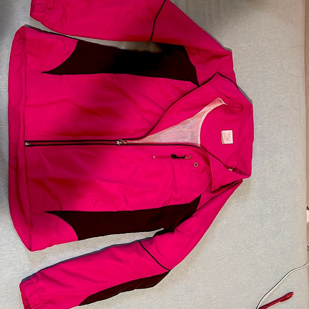 It’s pink and black jacket, it has 1 zip and 2 other pockets, white net inside.